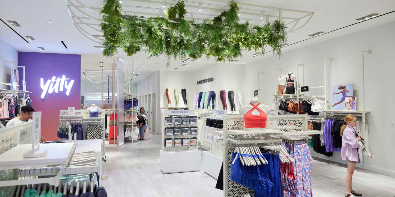 Clothing store with sports bras, leggings, and other women's athleticwear displayed throughout the store